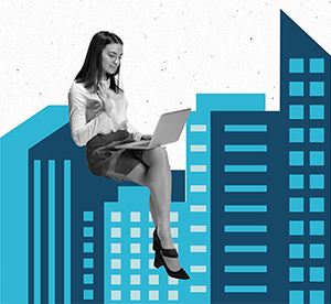 woman with laptop sitting atop city buildings